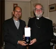 Monsignor Donald Bolen receives the St Augustine Award from Archbishop Rowan Williams