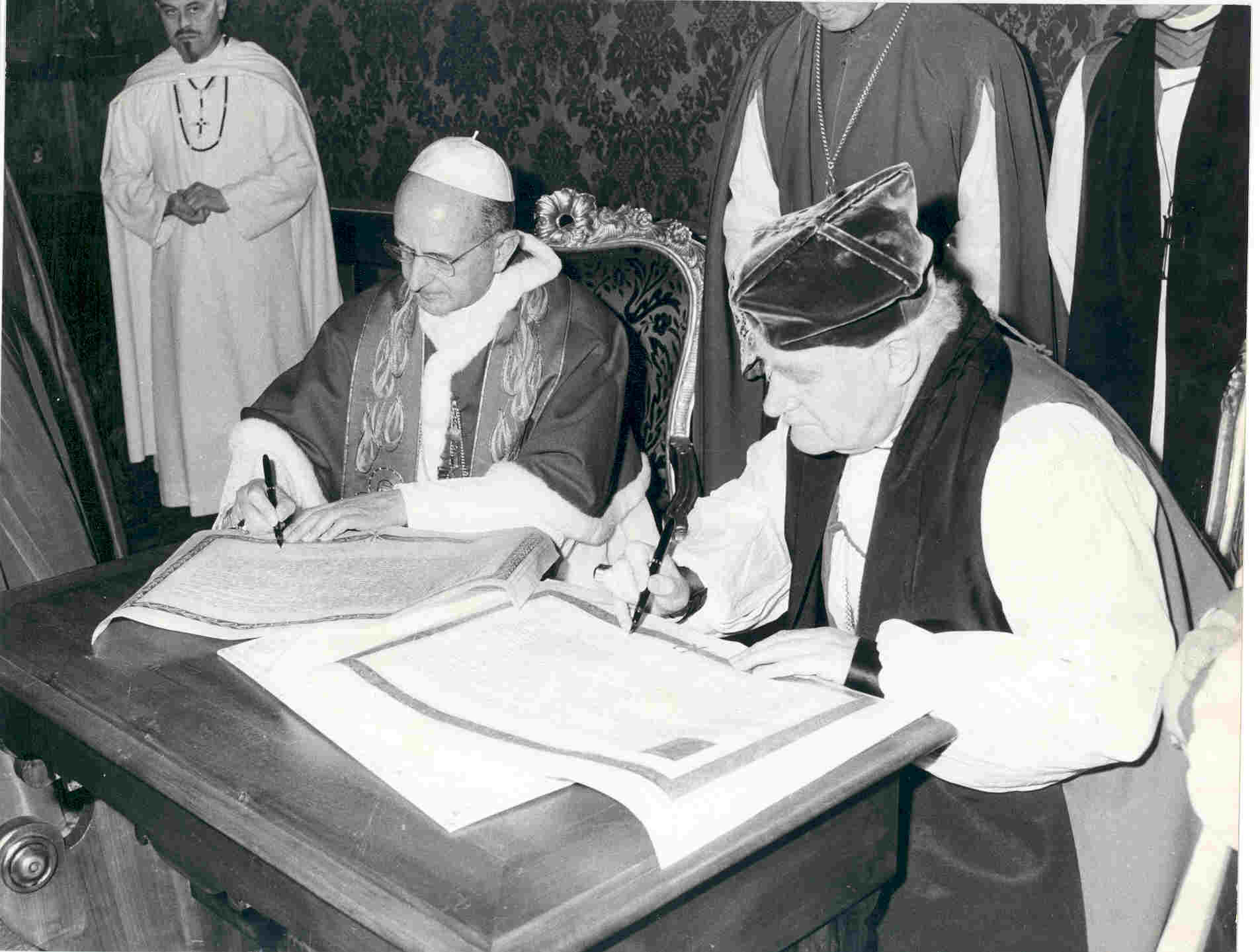 Pope Paul VI and Archbishop Michael Ramsey sign the first Common Declaration