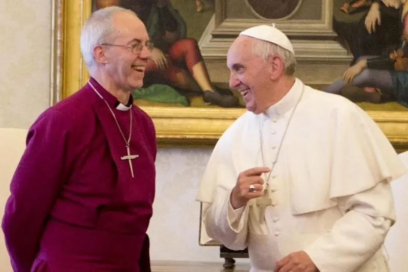 Archbishop Justin Welby and Pope Francis share a laugh during their first visit