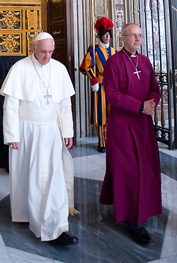 Pope Francis and Archbishop of Canterbury Justin Welby walking within the Vatican during the Archbishop's visit