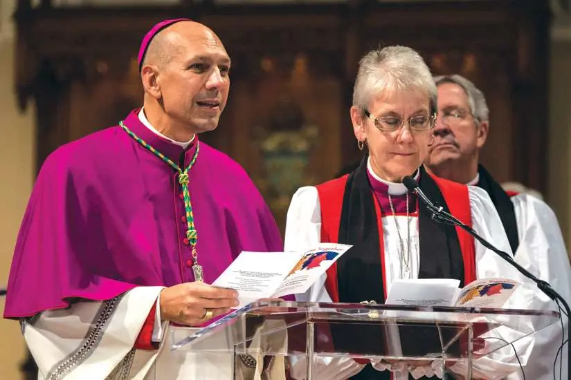 Saskatoon Bishop Don Bolen, left, presides with Anglican Bishop Linda Nicholls at an ecumenical celebration of the 50th anniversary of the 1964 Decree on Ecumenism from the Second Vatican Council. Bolen is now Archbishop of Regina and Nicholls is Archbishop and Primate of Canada