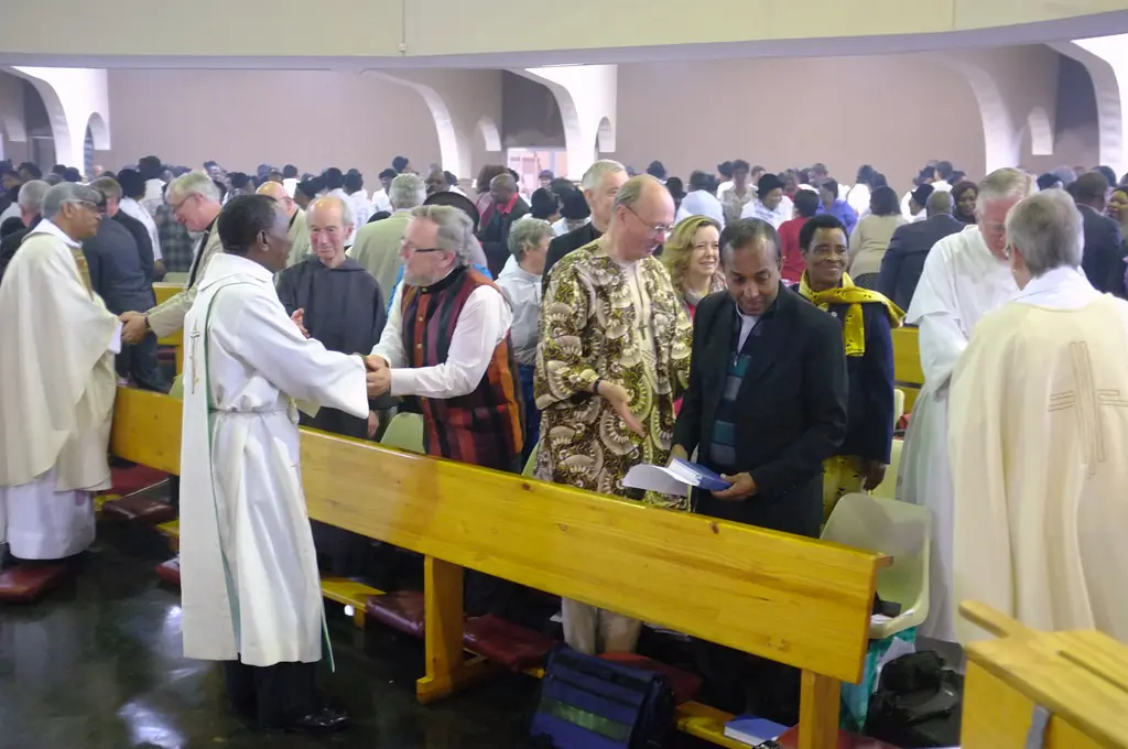 The sign of peace during the Anglican Eucharist at the ARCIC III meeting at Durban, South Africa (2014)