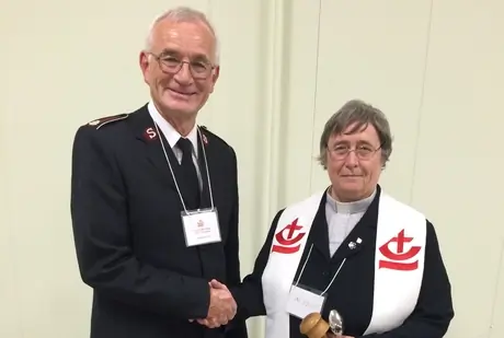 Lt. Col. Jim Champ congratulates his successor The Rev. Dr. Canon Alyson Barnett-Cowan, as President of the Canadian Council of Churches. Prior to her retirement, Barnett-Cowan was the Director of Unity, Faith, and Order at the Anglican Communion Office in London, England, and served as Interim General Secretary of the Anglican Communion