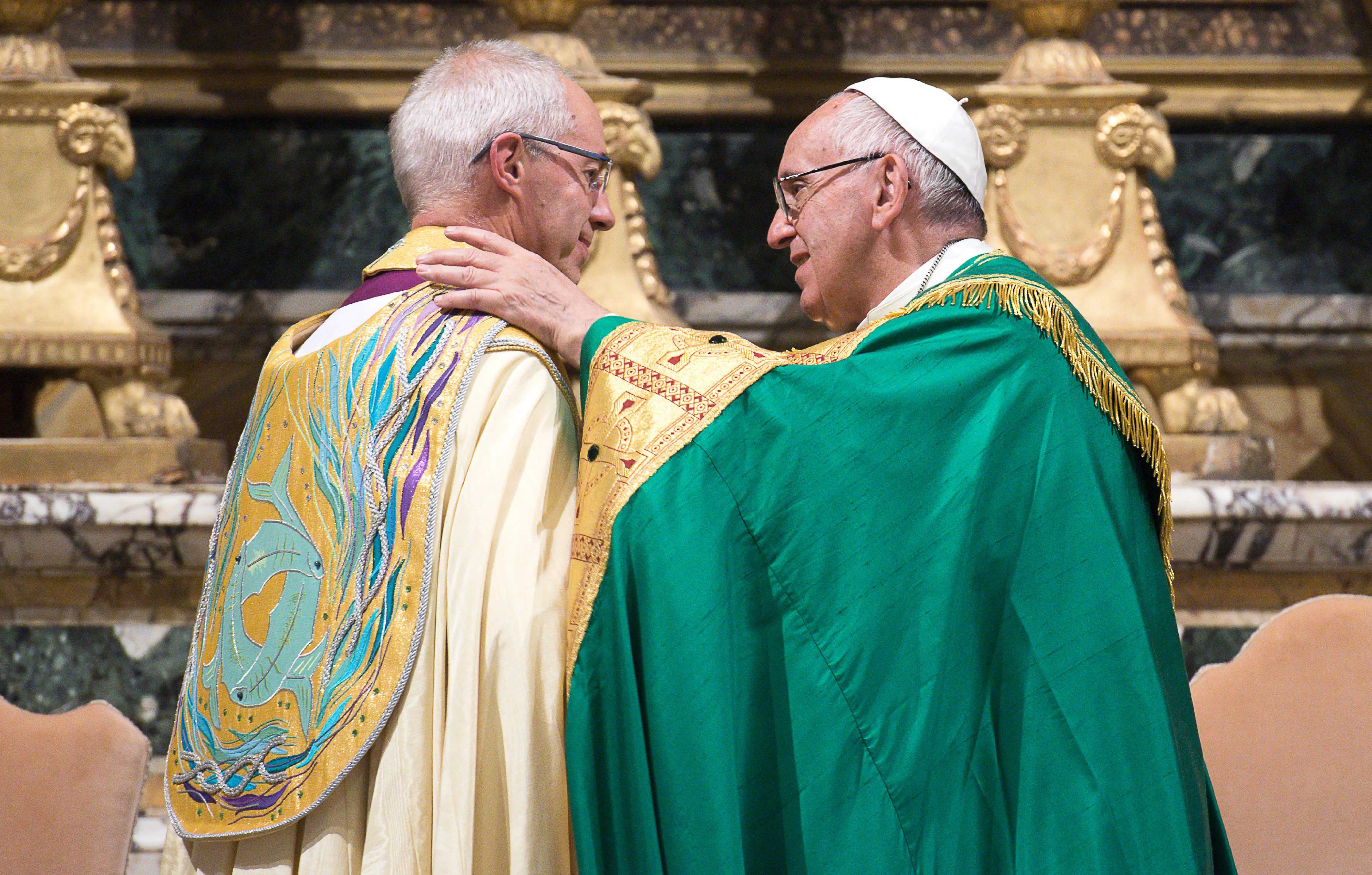 Pope Francis and Archbishop Justin Welby share a word and embrace during the Vespers at San Gregorio al Celio