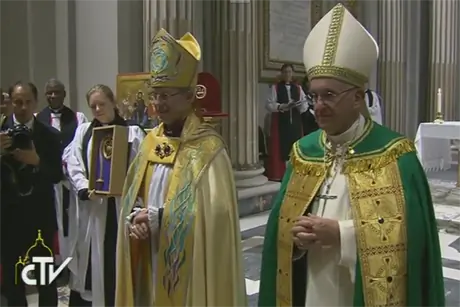 Archbishop Justin Welby and Pope Francis stand together in front of the congregation at the Vespers at San Gregorio al Celio