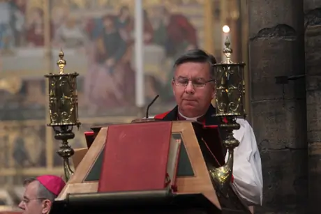 The Anglican Communion's spymaster general? Archbishop David Moxon, director of the Anglican Centre in Rome, reads a lesson during a special service of choral evensong at Westminster Abbey, marking the centre's 50th anniversary