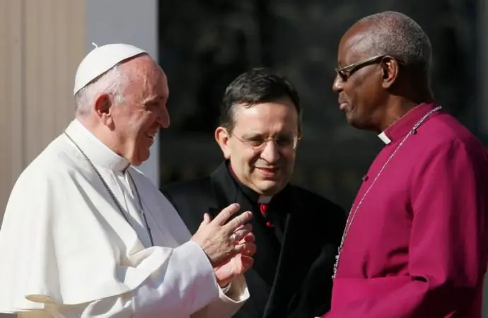 Pope Francis greets Anglican Archbishop Bernard Ntahoturi, director of the Anglican Centre in Rome and the archbishop of Canterbury's personal representative to the Holy See, during his general audience in St. Peter's Square at the Vatican