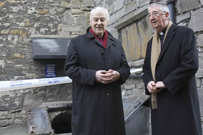 Archbishops Diarmuid Martin and Michael Jackson – the Roman Catholic and Anglican Archbishops of Dublin – outside the crypt of St Michan’s Church in Dublin, which was attached at the weekend by intruders who vandalised and stole mummified human remains