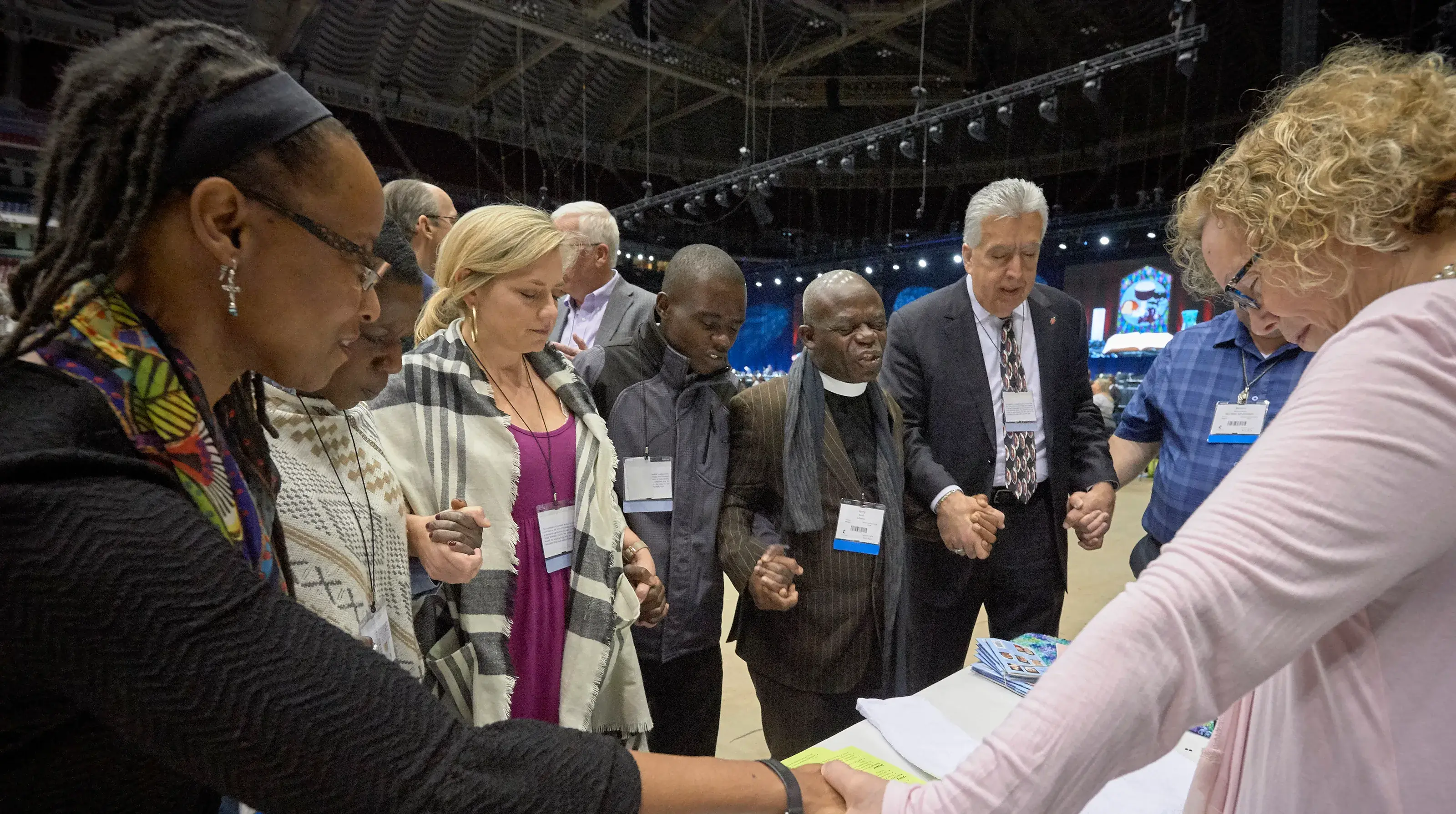 Delegates pray together during a Special Session of the General Conference of the United Methodist Church