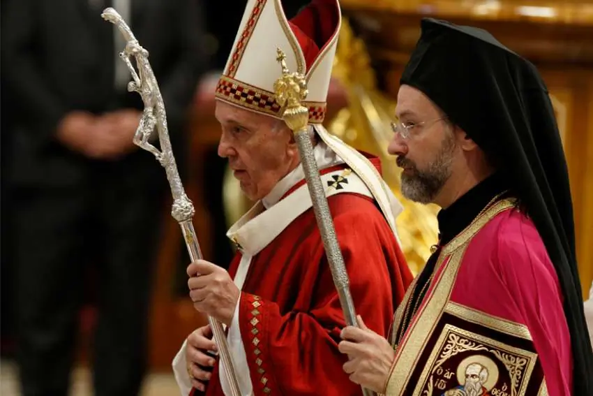 Pope Francis walks with Orthodox Archbishop Job of Telmessos as they leave Mass marking the feast of Sts. Peter and Paul in St. Peter's Basilica at the Vatican June 29, 2019. Archbishop Job was representing the Ecumenical Patriarchate of Constantinople