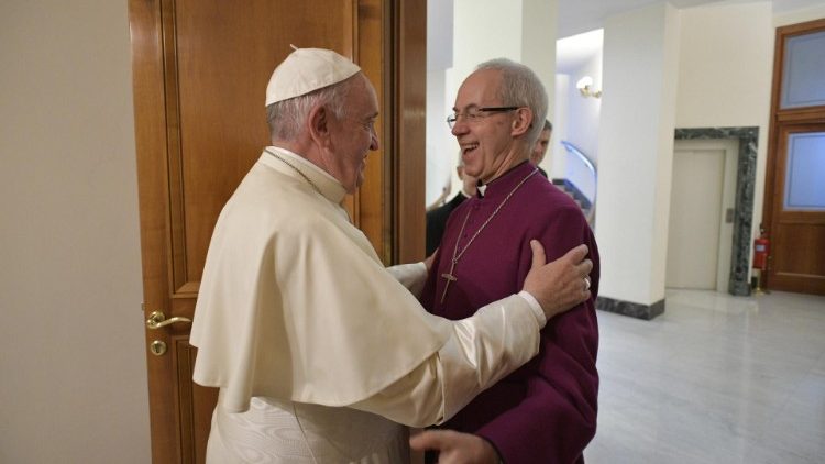 Pope Francis embraces Anglican Archbishop Justin Welby of Canterbury, leader of the Anglican Communion, during a meeting in the pope’s Vatican residence, the Domus Sanctae Marthae
