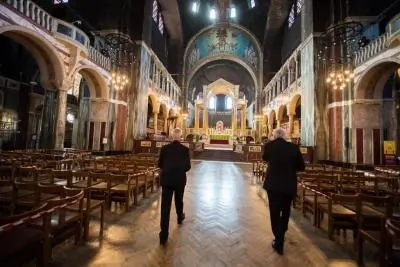 Cardinal Vincent Nichols and Archbishop Justin Welby walk down the aisle of Westminster Cathedral