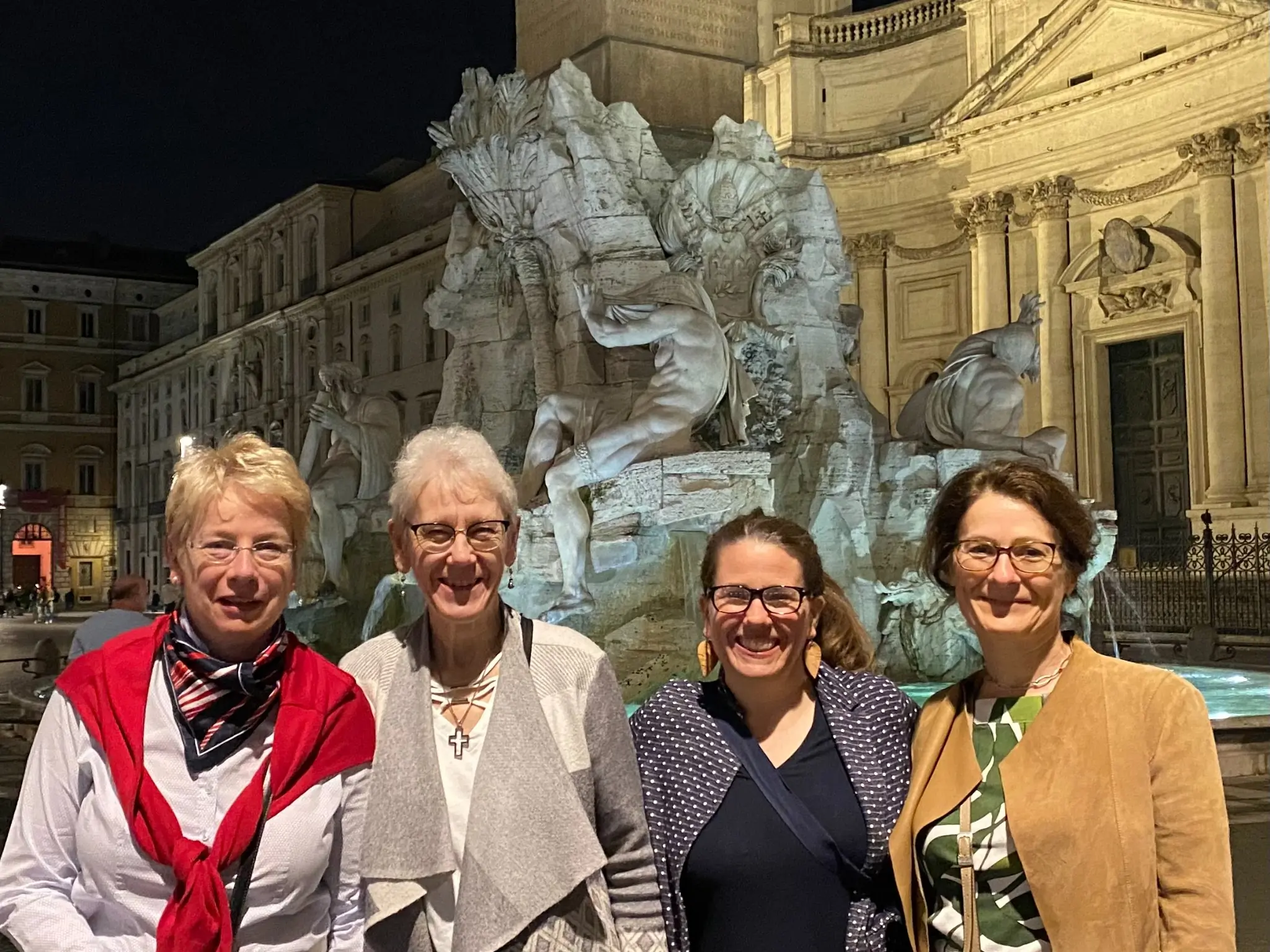 Members of ARCIC-III enjoying an evening stroll in the Piazza Navona in Rome. From left to right: Myriam Wijlens, Archbishop Linda Nicholls, Kristin Colberg, and Sigrid Müller. In the background, Bernini's <i>Fontana dei Quattro Fiumi</i> (Fountain of the Four Rivers, 1651) and the Church of Sant'Agnese in Agone