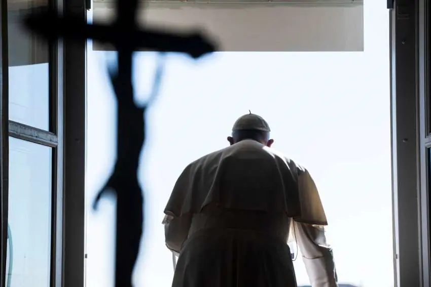 Pope Francis leads the Angelus from the window of his studio overlooking St. Peter's Square at the Vatican