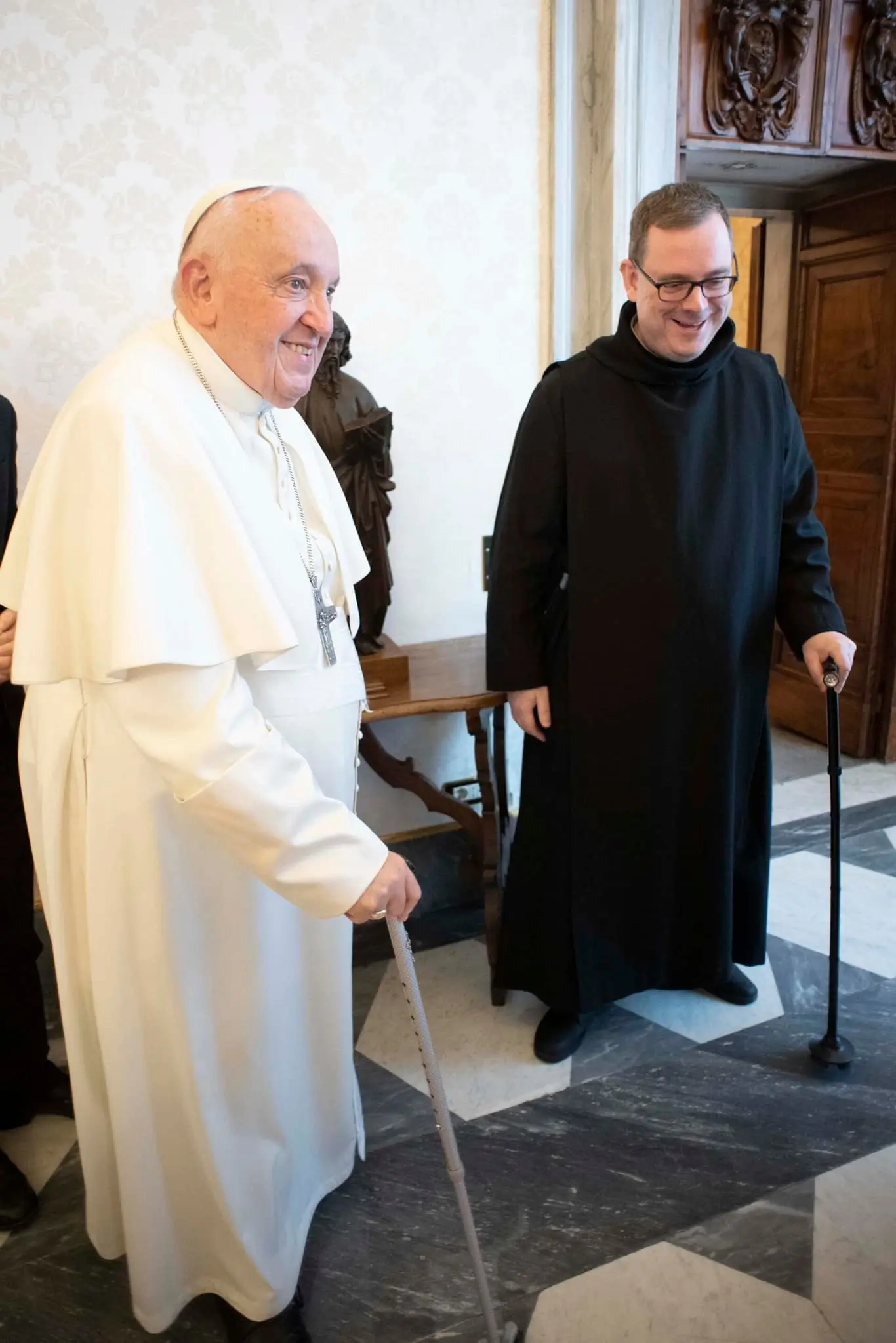Fr Martin Browne, staff responsible for Anglican-Catholic relations at the Dicastery for the Promotion of Christian Unity, compares canes with Pope Francis during the visit of Archbishop of York, Stephen Cottrell