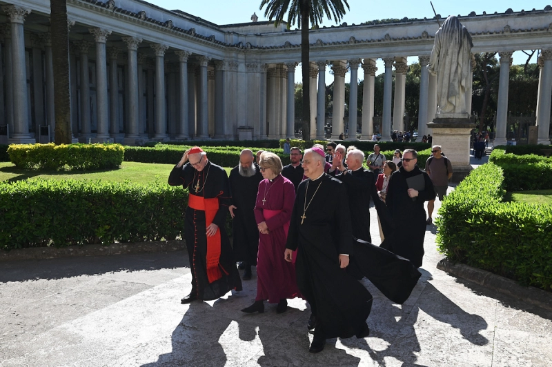 Archbishop of Canterbury Sarah Mullally is greeted by Cardinal James Michael Harvey, archpriest of the Basilica of St Paul Outside the Walls and Abbot Donato Ogliari, csb
