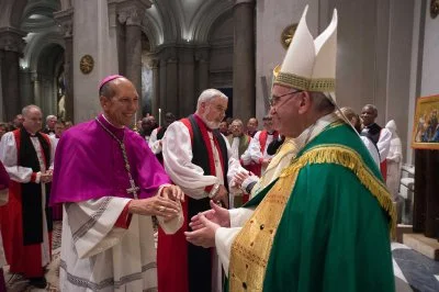 Pope Francis greets Archbishop Donald Bolen, co-chair of IARCCUM, at the Vespers in San Gregorio al Celio