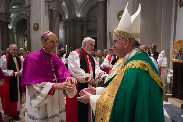 Pope Francis greets Archbishop Donald Bolen, co-chair of IARCCUM, at the Vespers in San Gregorio al Celio