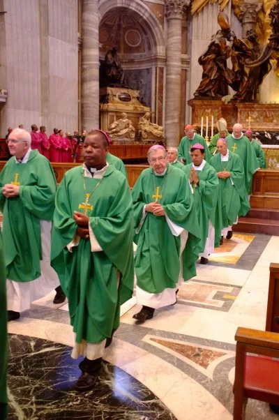 The Roman Catholic bishops of IARCCUM in green and the Anglican bishops of IARCCUM in red in the background. Each morning of the IARCCUM pilgrimage, the bishops celebrated the Eucahrist together, alternating between Anglican and Roman Catholic rites