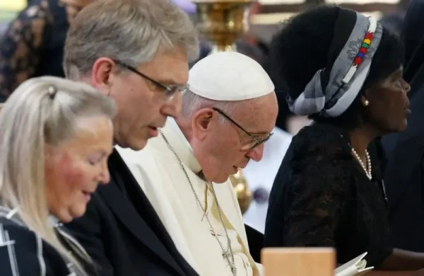 Pope Francis attends an ecumenical prayer service at the World Council of Churches' ecumenical center in Geneva in 2018. Responding in October to a WCC document on the nature and mission of the church, the Vatican said that while Catholics cannot share the Eucharist with other Christians, they can and should pray and work together. Photo: Paul Haring/CNS