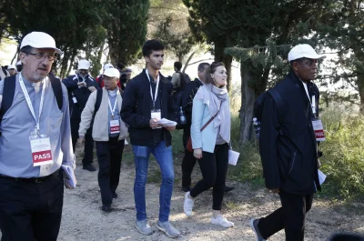 Sebastian Duhau, a synod observer from Australia, and Emilie Callan, a synod observer from Canada, participate in a pilgrimage hike from the Monte Mario nature reserve in Rome to St. Peter's Basilica at the Vatican Oct. 25. Cardinal Christoph Schonborn of Vienna said synodality refers to all the baptized taking responsibility for the church and its mission, each according to his or her talents and role within the church