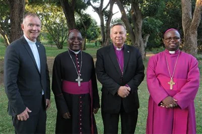 Fr. Keith Pecklers, SJ, Bishop Montfort Stima, Archbishop David Moxon, and Bishop Brighton Vitta Malasa