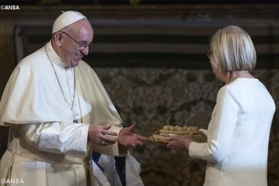 Pope Francis receives a 'Simnel Sunday' cake during his visit to Rome's All Saints Anglican Church