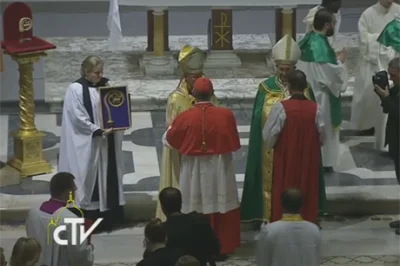 A priest holds the replica of the Crozier of St Gregory the Great - the sixth Century Pope who sent Augustine to evangelise the Anglo-Saxons - as Pope Francis and Archbishop Justin Welby greet pairs of bishops being sent out for joint mission. The actual crozier is on a pedestal in the top left hand corner of the picture