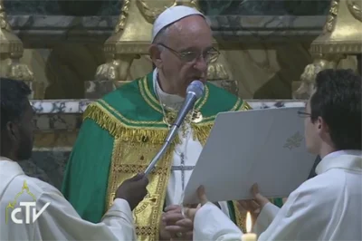 Pope Francis wears the Cross of Nails given to him by Archbishop Justin Welby as he gives a blessing during a service of Vespers at the Church of San Gregorio al Celio