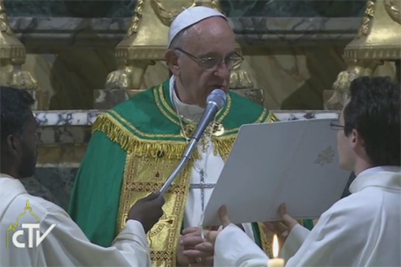 Pope Francis wears the Cross of Nails given to him by Archbishop Justin Welby as he gives a blessing during a service of Vespers at the Church of San Gregorio al Celio