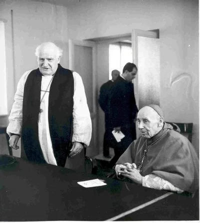 Archbishop of Canterbury Michael Ramsey and Cardinal Augustin Bea meet at the Secretariat for Promoting Christian Unity during the visit of the Archbishop to Pope Paul VI