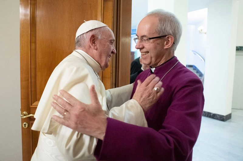 Pope Francis embraces Anglican Archbishop Justin Welby of Canterbury, leader of the Anglican Communion, during a meeting in the pope’s Vatican residence, the Domus Sanctae Marthae