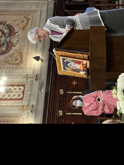 Archbishop Linda Nicholls reads scripture at Caravita