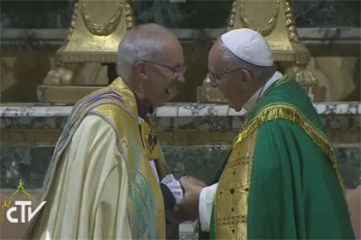 Pope Francis and Archbishop Justin Welby share a word and embrace during the Vespers at San Gregorio al Celio