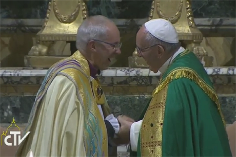 Pope Francis and Archbishop Justin Welby share a word and embrace during the Vespers at San Gregorio al Celio