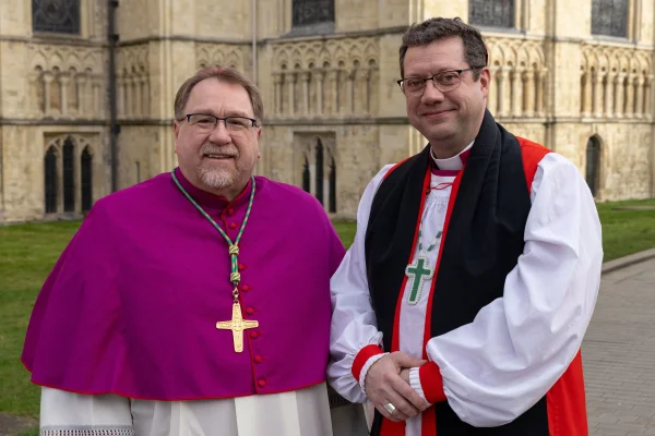 IARCCUM bishops from Canada, Most Rev Martin Laliberté, PME, bishop of Trois-Rivières and Rt Rev Bruce Myers, OGS, bishop of Québec, stop for a photo outside Canterbury Cathedral. Bishop pairs from 27 countries were commissioned by Pope Francis and Archbishop of Canterbury Justin Welby at the Basilica of St Paul Outside the Walls in Rome before travelling to Canterbury for further work and prayer together