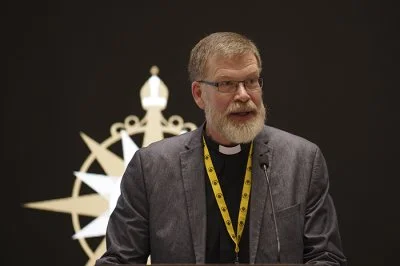 The Revd Canon Dr John Gibaut addresses members of the Anglican Consultative Council (ACC-17) meeting in Hong Kong