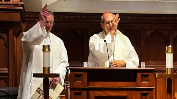 Bishop Robert Innes and Archbishop Donald Bolen, co-chairs of IARCCUM, offer a blessing during prayers at Georgetown Univeristy