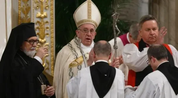 Pope Francis delivers a joint blessing with Orthodox Metropolitan Gennadios of Italy and Malta and Anglican Archbishop David Moxon, the archbishop of Canterbury's representative to the Vatican, during an ecumenical prayer service to conclude the Week of Prayer for Christian Unity at the Basilica of St. Paul Outside the Walls in Rome