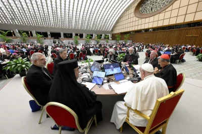 Pope Francis and members of the Synod of Bishops on synodality attend the synod's final working session in the Paul VI Audience Hall at the Vatican