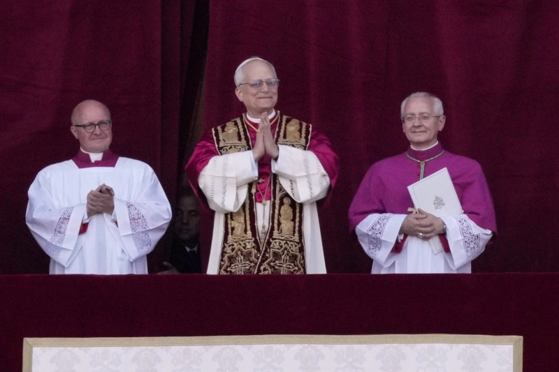 Pope Leo XIV appears on the loggia in St. Peter's Basilica after his election as the 267th pope and bishop of Rome