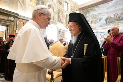 Pope Leo XIV greets Patriarch Bartholomew of Constantinople during an audience with ecumenical guests on the day after the inaugural Mass of of his papacy