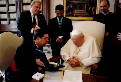 During their visit to Rome for Informal Talks, leaders of the Anglican and Roman Catholic dialogue visited Pope John Paul II at the Apostolic Palace. Revd Canon John L. Peterson, Secretary General of the Anglican Communion, seated. Standing: James Rosenthal (ACO Communications), unknown, and Rev Donald Bolen (PCPCU)