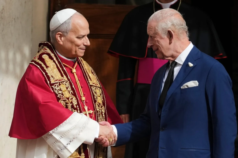 Pope Leo XIV with Britain's King Charles III in the St. Damasus Courtyard at the Vatican after a state visit and prayer in the Sistine Chapel