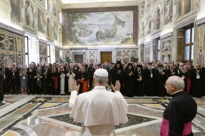 Pope Leo XIV greets participants of a symposium in Rome
