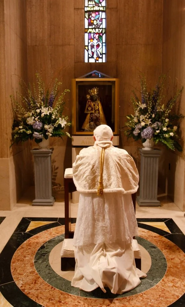 Pope Benedict XVI prays in a small alcove dedicated to Our Lady of Altotting inside the Basilica of the National Shrine of the Immaculate Conception in Washington