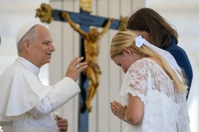 Pope Leo XIV blesses a newlywed couple
