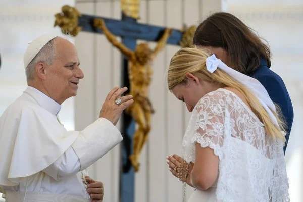 Pope Leo XIV blesses a newlywed couple
