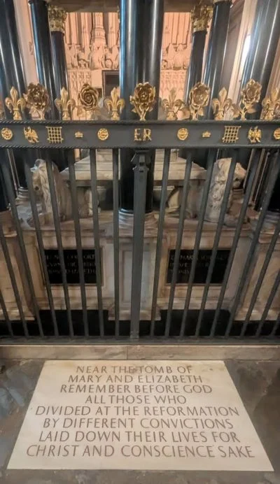 The tombs of Elizabeth and Mary Tudor in Westminster Abbey. Sisters and daughters of Henry VIII, the older Latin inscription on the interior translates as "Consorts in realm and tomb, here we sleep, Elizabeth and Mary, sisters, in hope of resurrection"
