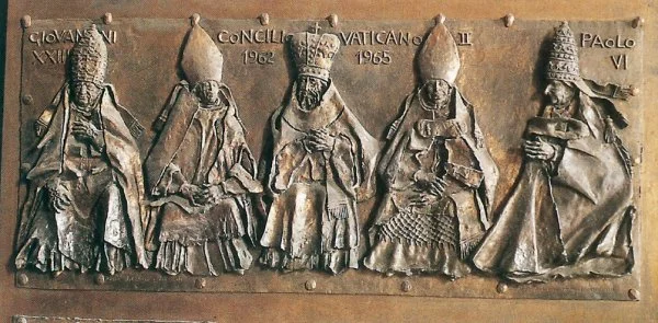 A panel from the Door of Good and Evil in the atrium of St. Peter's Basilica. The panel depicts the Second Vatican Council, with Pope John XXIII and the left and Pope Paul VI on the right. The panel was sculpted by artist Luciano Minguzzi between 1970 and 1977